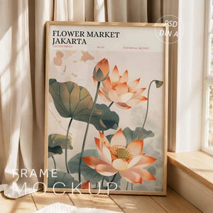 May include: A framed vertical art print featuring a botanical illustration of two lotus flowers in shades of peach and white with large green leaves. The text reads FLOWER MARKET JAKARTA, GALLERY PRINTS, NO.26, and BOTANICAL ARCHIVE in black and red.