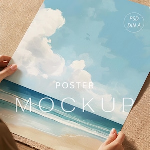 May include: A rectangular poster mockup featuring a painted coastal scene with a light blue sky, white clouds, a dark blue ocean, and a sandy beach. The text PSD DIN A, POSTER, and MOCKUP are printed in white on the surface of the poster.