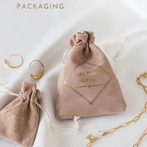 a bag with a ring and a bracelet on it