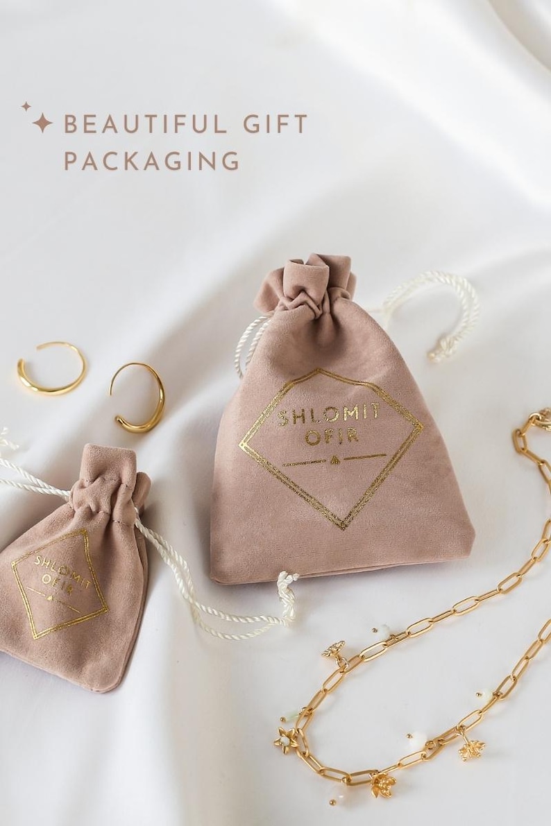 a bag with a ring and a bracelet on it