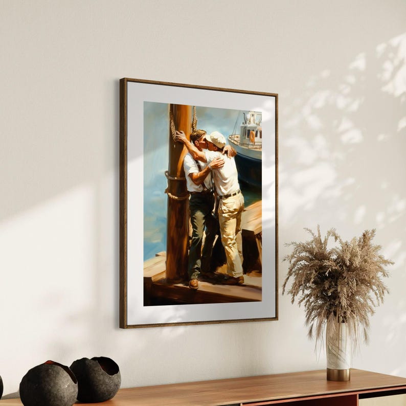 May include: A framed art print depicting two people embracing on a dock. The artwork features a warm color palette with a boat in the background. The subjects are wearing casual clothing, and the scene evokes a sense of intimacy.
