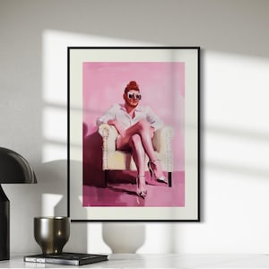 May include: A painting of a person wearing a white shirt and sunglasses sitting in a white chair against a pink background.