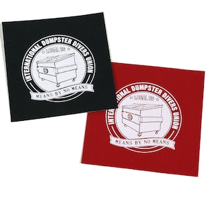 May include: Two square patches with the logo of the International Dumpster Divers Union. The logo is a white circle with the words "International Dumpster Divers Union" and "Local 86" around a drawing of a dumpster. The text "Means by No Means" is written on a banner below the dumpster. One patch is black with white text and the other is red with white text.