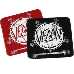May include: Two iron-on patches with a pentagram and the word "VEGAN" in white lettering on a black and red background.