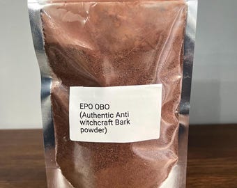 May include: A clear, sealed pouch containing brown powder. A white label on the front reads "EPO OBO (Authentic Anti witchcraft Bark powder)". The pouch is made of a shiny, metallic material and is sealed at the top. The background is a wooden surface.