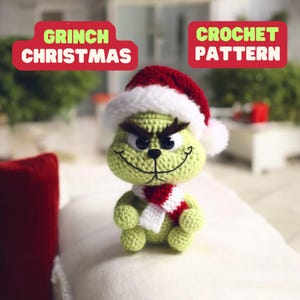 May include: Grinch Christmas Crochet Pattern. A green crocheted Grinch wearing a red and white Santa hat and a red and white scarf.