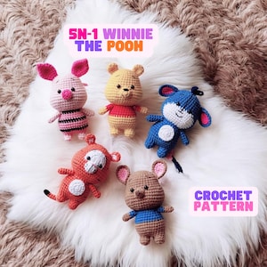 May include: Crochet pattern for five Winnie the Pooh characters: Piglet, Winnie the Pooh, Eeyore, Tigger, and Roo. The characters are all crocheted in different colors and have different facial expressions.