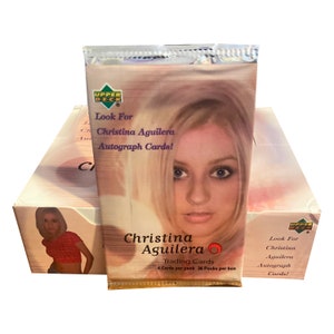 1 Packung Christina Aguilera Sammelkarten. 4 Karten pro Packung. Zufällig eingefügte Autogrammkarten! Sammle sie alle! Oberdeck 2000.