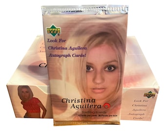 1 pack of Christina Aguilera vintage trading cards. 4 cards per pack. Randomly inserted autograph cards! Collect them all! Upper Deck 2000.