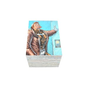 May include: A pile of comic book trading cards. The top card shows a colour illustration of a man in a brown coat, leaning against a blue wall. The man has red hair and is smoking. The cards are stacked on a white background.