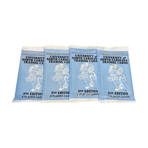 May include: Four light blue trading card packs from the University of North Carolina's Collegiate Collection. Each pack features a cartoon mascot and the text "2nd Edition" and "8 Player Cards" or "6 Player Cards".