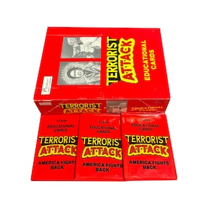 May include: A red box and three red card packs with the words "TERRORIST ATTACK" in yellow and black. The box and card packs also have the words "EDUCATIONAL CARDS" and "AMERICA FIGHTS BACK".