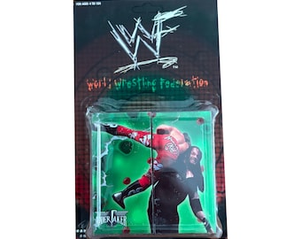 WWF The Undertaker vintage Pro Cube brand new in package. Featuring 9 different photos of The Undertaker on a 6-sided object! Made in 1998.