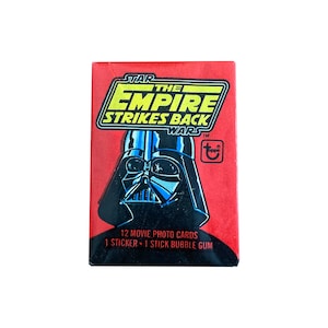 Star Wars The Empire Strikes Back Series 1 vintage waxpakket. 12 kaarten en 1 sticker per pak. Uitstekende staat! Leuk! Topps 1980.