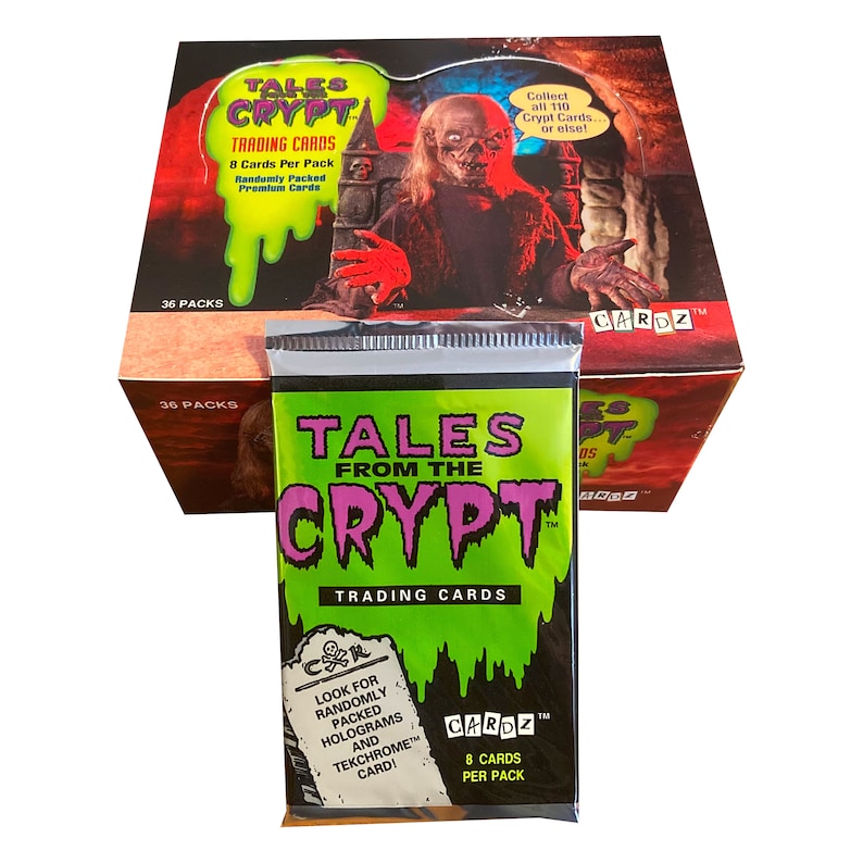 May include: A box of "Tales From The Crypt" trading cards with a pack in front. The box features a ghoul illustration and the text "Trading Cards." The pack is green and black with the series logo and says "8 Cards Per Pack."