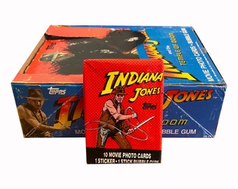 1 pack of Indiana Jones and the Temple of Doom vintage trading cards. 10 cards and 1 sticker in each vintage wax pack. Topps 1984. Nice!