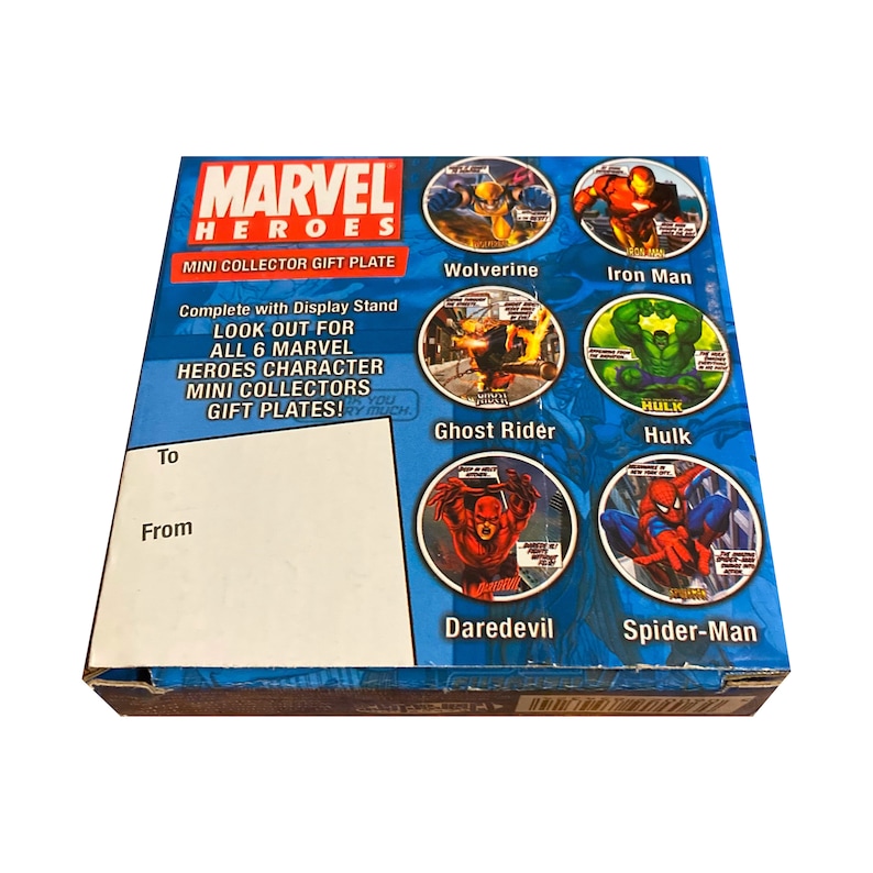 May include: A blue and white box with a Marvel Heroes logo and images of six Marvel characters: Wolverine, Iron Man, Ghost Rider, Hulk, Daredevil, and Spider-Man. The box is a mini collector gift plate.