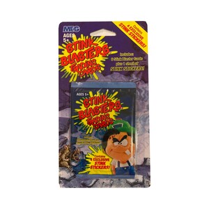 1 paquet de cartes à collectionner vintage Stink Blasters. Paquet de 6 cartes + 1 feuille d'autocollants puants. Collectionnez les 144 ! MEG 2002.