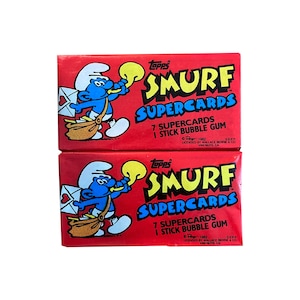 2 packs of Smurf Supercards vintage trading cards. 7 cards per pack. Collect all 56! Topps 1982. Papa Smurf Smurfette Gargamel and more!