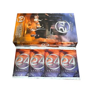 May include: A box of "24" Season 3 trading cards with multiple unopened packs. The box features images of actors from the show and the text "24 Fox Television's Real Time Drama!" The packs have the "24" logo.