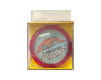 The Amazing Spider-Man vintage Duncan lenticular yo-yo in original (opened) packaging. Measures 2.25" across. Made in 1978. Marvel Universe.