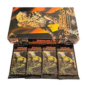 May include: A display box and four individual packs of Bernie Wrightson Series II: More Macabre trading cards. The packaging features orange and black artwork of a creature, with the text Bernie Wrightson Series II: More Macabre printed on each.