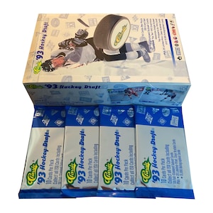 May include: A box of 1993 Classic Hockey Draft trading cards. The box is blue and white with a picture of a hockey player on the front. The box contains four packs of cards, each with 10 cards per pack. The packs are blue and white with the words "Classic 93 Hockey Draft" printed on them.
