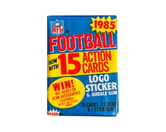 1985 Fleer Football Action Cards vintage unopened wax pack. 15 cards + 1 logo sticker per pack. Fleer 1985.