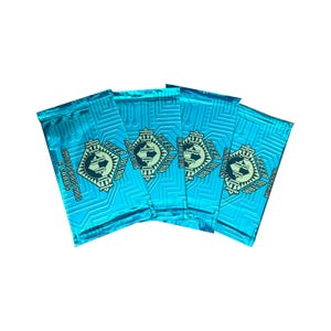 May include: Four packs of Fleer Ultra Premier Edition trading cards. The packs are a bright teal color with a repeating circuit board pattern. Each pack has the Fleer Ultra logo and the text "6 Cards".
