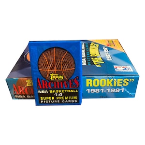 Topps アーカイブ NBA バスケットボール 1981-1991「The Rookies」ビンテージ トレーディング カード 1 パック。1 パックあたり 14 枚のスーパー プレミアム ピクチャー カード。Topps 1991。