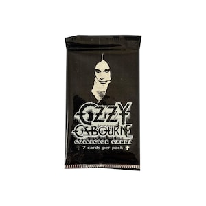 May include: A black, sealed pack of Ozzy Osbourne collector cards. The front displays a portrait of Ozzy Osbourne and the text "OZZY OSBOURNE" in a stylized font. The text "COLLECTOR CARDS" and "7 cards per pack" are also visible.