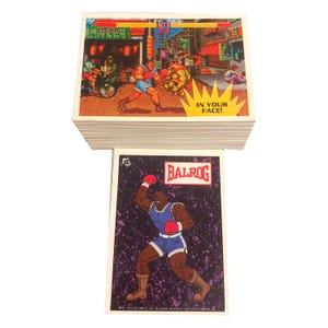 Street Fighter II complete set of 88 vintage trading cards + 11 stickers in excellent condition. Cards are individually sleeved. Topps 1993.