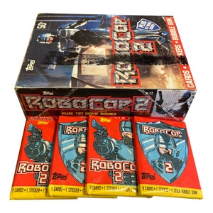 4 Packungen Robocop 2 Vintage-Sammelkarten. Jede Packung enthält 9 Karten und jeweils 1 Aufkleber. 2 von jeder Hülle. Topps 1990. Sammeln Sie sie alle!