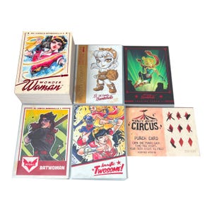 May include: A collection of DC Comics Bombshells trading cards featuring Wonder Woman, Batwoman, and Harley Quinn. The cards showcase colorful illustrations with text including "Wonder Woman", "Batwoman", and "Harley Quinn's Circus".