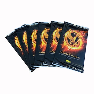 6 packs of The Hunger Games premium trading cards. 6 cards per pack. Nice gift for Hunger Games fans! Jennifer Lawrence as Katniss Everdeen.