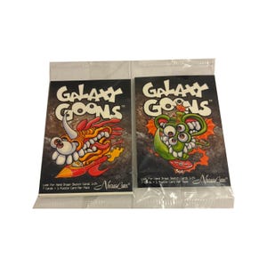 2 packs of Galaxy Goons vintage trading cards. 7 cards + 1 puzzle card per pack. Collect them all! NostalgiCards 2002. Only 300 boxes made!