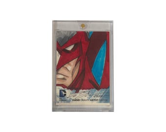 DC Comics: The New 52 original hand-drawn artist sketch card in heavy duty plastic holder. Produced by Cryptozoic.