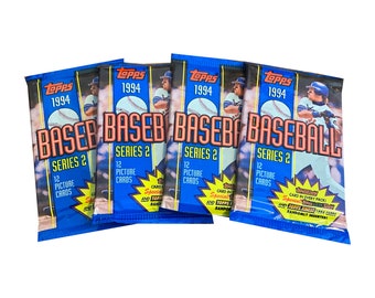 May include: Several packs of 1994 Topps Series 2 baseball cards. Each pack is blue with the Topps logo and the word "BASEBALL" in large letters. The packs contain 12 picture cards and special inserts.