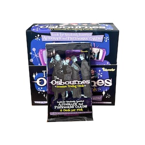 May include: A pack of "The Osbournes" premium trading cards, with a box of cards in the background. The pack features a photo of the Osbourne family. The box and pack both have text that reads "Look for Randomly Inserted AUTOGRAPH and PIECEWORKS CARDS!"