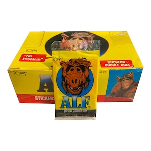 1 pacote de cartas colecionáveis ALF Série 1. Versão raramente vista no Reino Unido. Lançado pela Topps Ireland em 1987. "Sem problemas." Colecionável raro ALF.