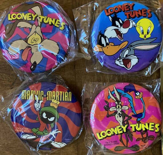 4 vintage Looney Tunes buttons. Your choice of 4 from 12 different designs. 2 1/4" buttons. See item description for details. Great deal!
