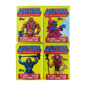 1 confezione di cera vintage Masters Of the Universe in ottime condizioni. Scegli il tuo stile di involucro. Scheletro di He-Man Orko Teela. Topps 1984.