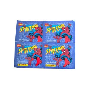 May include: Four blue packs of Spider-Man collectible stickers. Each pack displays the Marvel Comics logo and the words "Spider-Man" in yellow. The image of Spider-Man is in red and blue, with a spider web background.