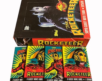 4 packs of The Rocketeer vintage trading cards. Topps 1991. 8 glossy movie cards and 1 sticker per pack. Collect them all!