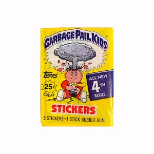 May include: A yellow Garbage Pail Kids sticker pack with a cartoon character holding a video game controller. The pack features the text "Garbage Pail Kids", "Topps", "25¢ Cheap", "All New 4th Series", "Stickers", and "5 Stickers 1 Stick Bubble Gum".