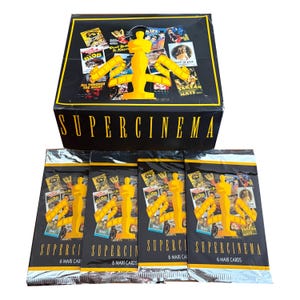 May include: A black box set of Supercinema trading cards with a gold Oscar statue design. The box and card packs feature movie posters and the text "Supercinema" and "6 Maxi Cards".