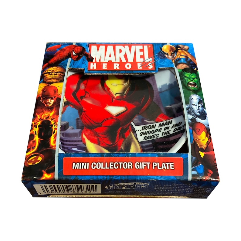 May include: A red and gold Marvel Heroes mini collector gift plate featuring Iron Man. The plate has a white background with a cityscape design. The text on the plate reads "...Iron Man swoops in and saves the day!"