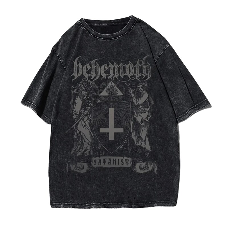 May include: Dark grey t-shirt with a distressed finish. The front displays the word "Behemoth" in gothic lettering above a graphic of a shield with a cross and figures. The text "the Satanist" is below the shield.