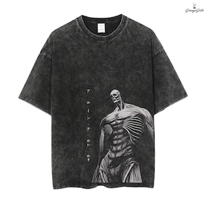May include: Dark gray, acid wash t-shirt featuring a skeletal figure graphic. The design includes Japanese text on the left side. The shirt has a crew neck and short sleeves, with a grunge aesthetic.