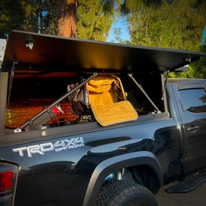 GFC Camper - Hang duffels as cabinets.  Overlanding and truck camping storage & accessories for GFC Campers.